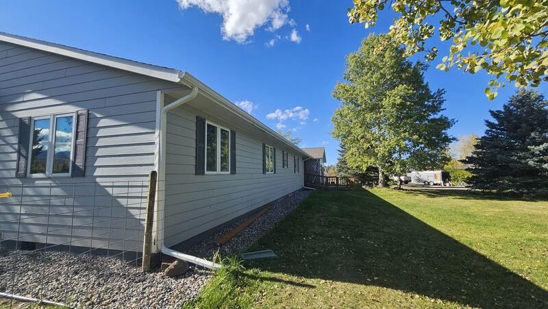 New lap siding & seamless gutters — Montana