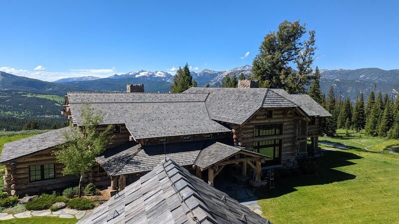 Cedar shake roof on a log estate below Lone Peak